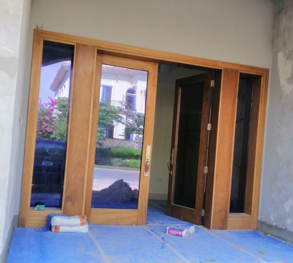 "image-of-a-villa-front-door-with-wood-and-glass"