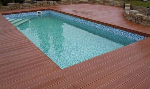 "image-swimming-pool-deck-with-wood-look-composite-decking-planks"